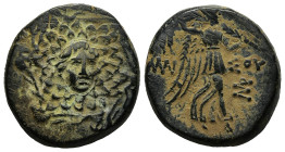 PONTOS.Amisos.(Circa 105-63 BC).Ae.

Obv : Aegis with Gorgon's head at center.

Rev : AΜΙΣΟΥ.
Nike advancing right, holding wreath and palm branch, be...