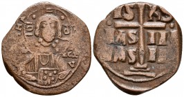 ANONIMO Atribuído a ROMANUS III. Follis. 1028-1034 d.C. Constantinopolis. A/ Busto de Cristo de frente, levantando la mano en bendición y sosteniendo ...