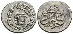 IONIA. Ephesos. Cistophor. Dated Year 4 (131/30 BC).
Obv: Cista mystica with serpent; all within ivy wreath.
Rev: EΦΕ.
Bow case between two serpents. ...
