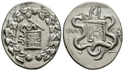 LYDIA. Tralleis. Circa 166-67 BC. Tetradrachm, Cistophoric standard, circa 155-145 BC. Basket (cista mystica) from which snake coils; around, ivy wrea...