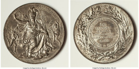 "Collège Stanislas de Paris First Place Award" tin Medal 1899 AU, 68mm. 103.32gm. Awarded to Francois Bruel. Seated figure in clouds holding laurel wr...