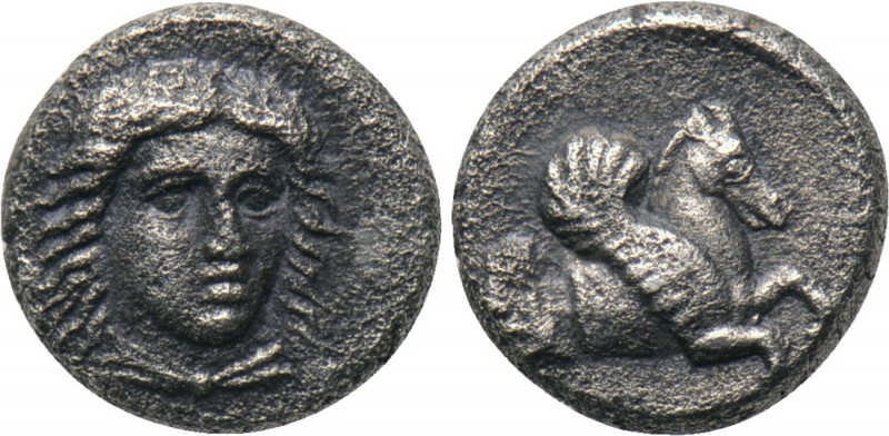 CARIA. Uncertain. Hemiobol (5th-4th centuries BC). 

Obv: Draped bust of Apoll...