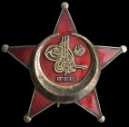 Turkey, Great War Medal, unmarked, possibly of Austrian manufacture, in silver-gilt and enamel, with unusually large tughra and vertical retaining pin...