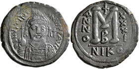 Justinian I, 527-565. Follis (Bronze, 34 mm, 17.74 g, 7 h), Nicomedia, RY 31 = 557/8. D N IVSTINIANVS P P AVI Helmeted and cuirassed bust of Justinian...