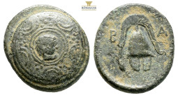 Kings of Macedon, Alexander III 'the Great'. 336-323 BC. AE (3.96g, 17.1mm) Struck under Menander, circa 324/3 BC. Macedonian shield; facing gorgoneio...