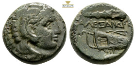 Kings of Macedon, Alexander III the Great 336-323 BC. AE (6.72g, 171mm). Head of Herakles to right, wearing lion skin headdress. [AΛΕ]ΞΑΝΔΡ[ΟΥ], bow-i...