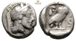 Attica, Athens AR Drachm. Circa 454-404 BC. (4.13g, 15.1mm) Head of Athena to right, wearing earring, necklace, and crested Attic helmet decorated wit...