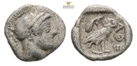 Attica, Athens AR Obol. Circa 454-404 BC. (0.63g, 8.8mm) Head of Athena to right, wearing earring, necklace, and crested Attic helmet decorated with t...