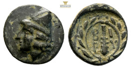 Troas, Birytis AE Circa 350-300 BC. (1.31g, 12.1mm) Head of Kabeiros to left, wearing pileos; two stars above / Club within wreath; B I P Y in fields....