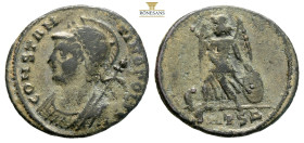 City Commemorative AE follis. (2.46g, 18.9mm) Struck under Constantine I. Thessalonica, AD 330-333. CONSTANTINOPOLIS, laureate, helmeted and mantled b...