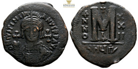 Justinian I. AE 40 Nummi. Theoupolis (Antioch), (17.19g, 36mm) dated RY 20 = AD 546/7. D N IVSTINIANVS P P AVI, helmeted and cuirassed bust facing, ho...