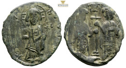 Constantine X Ducas, with Eudocia, AE Nummi. Constantinople, AD 1059-1067. (5g, 25.3mm). [+ EMMA] NOV[HΛ], Christ standing facing on footstool, holdin...