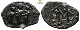 Heraclius, with Martina and Heraclius Constantine. AE Nummi. AD 610-641. (4.80g, 28.8mm) Constantinople. Heraclius, in center, flanked by Martina, on ...