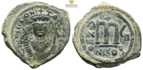 Tiberius II Constantine. Nicomedia, AE 40 Νummi. (12.90g, 31.7mm) dated RY 6 = AD 579/80. ᓂ m TIB CONSTANT P P AVC, crowned bust facing, wearing consu...