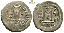 Tiberius II Constantine. Nicomedia, AE 40 Νummi. (11.11g, 30.5mm) dated RY 6 = AD 579/80. ᓂ m TIB CONSTANT P P AVC, crowned bust facing, wearing consu...