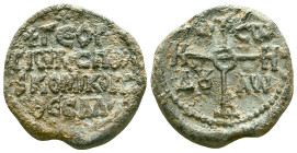 Byzantine lead seal (10th–12th century), bearing a central cross on the obverse with the abbreviation IC XC / NIKA, meaning "Jesus Christ conquers". T...