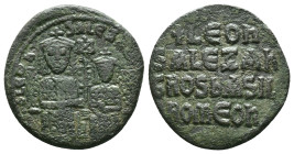Leo VI Æ Nummus. Constantinople, AD 886-912. +LEON + S ALЄXAndROS, Leo on the left and Alexander on the right, seated facing on double throne, each we...