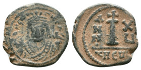 JUSTINIAN I.527-565 AD.Antioch mint.AE Decanummium. DN IVSTINIANVS PP AVG, helmeted, cuirassed bust facing, holding cross on globe and long sceptre, c...