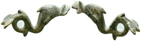 Bronze decorative fitting or mount in the form of dolphin-like sea creatures. Each creature curves gracefully, with rounded bodies and stylized fins, ...