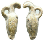 A miniature Lead amphora-shaped object.Such miniature amphorae were sometimes used in rituals or deposited in sacred or funerary contexts to symbolize...