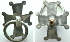 Medieval bronze cross-shaped harness or belt fitting with an integrated circular suspension ring, likely dating from the 12th to 14th century AD. Refe...