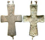 Byzantine bronze enkolpion cross reliquary pendant, likely dating from the 10th to 12th century AD. On the front, there is an engraved depiction of th...