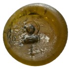 This is a circular, mold-pressed Byzantine glass token or seal, often referred to as a pilgrim token. 6th–8th century AD.These small devotional object...