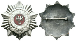 Polish PRL-era Railway Worker’s Badge,circa 1950s–1980s A radiant starburst motif forming the background, reminiscent of socialist-style decorations. ...