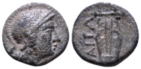 AEOLIS. Aegae. 3rd century BC. Obv: Helmeted head of Athena, right. Rev: AIΓA Lyre. Æ 11mm, 0,97g