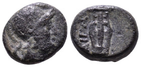 AEOLIS. Aegae. 3rd century BC. Obv: Helmeted head of Athena, right. Rev: AIΓA Lyre. Æ 10mm, 1,43g