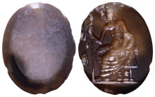 Roman Intaglio Gem. Deity(Jupiter?) sitting on trophy holding a scepter. 15mm, 0,94g