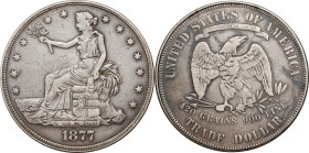 Box Dollar fashioned out of the obverse of an 1877-dated trade dollar and the reverse of a Philadelphia Mint trade dollar. Extremely Fine/Very Fine.