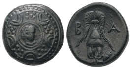 Kings of Macedon, Alexander III 'the Great'. Ae, 3.91 g 15.54 mm. 336-323 BC. Uncertain mint in Asia.
Obv: Macedonian shield; on boss, head of Herakle...