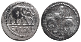 Julius Caesar, 49 BC. AR, Denarius. 3.64 g. 18.88 mm. Rome.
Obv: CAESAR. Elephant advancing right, trampling upon horned serpent.
Rev: Emblems of the ...