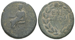 Ionia, Ephesus. Pseudo-autonomous, time of the Antonines? AE. 11.02 g. 25.07 mm.
Obv: Figure of laureate emperor seated left on curule chair, holding ...