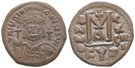 Justinian I, AD 527-565. AE, Follis. 15.81 g. 31.85 mm. Cyzicus.
Obv: DNIVSTINI-ANVS PPAVC. Frontal bust of Justinian I wearing helmet with plume, dia...