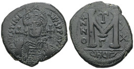 Justinian I, AD 527-565. AE, Follis. 19.22 g. 36.85 mm. Theoupolis (Antioch).
Obv: DNIVSTINI-ANVS PPAVC. Frontal bust of Justinian I wearing helmet wi...