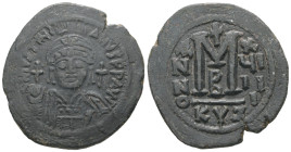 Justinian I, AD 527-565. AE, Follis. 21.34 g. 35.51 mm. Cyzicus. 
Obv: DNIVSTINI-ANVS PPAVC. Frontal bust of Justinian I wearing helmet with plume, di...
