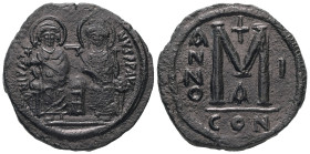 Justin II and Sophia. AD 565-578. AE, Follis. 14.80 g. 30.24 mm. Constantinople.
Obv: DNIVSTI-NVSPPAVC. Justin II on left and Sophia on right, seated,...