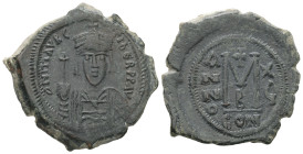 Maurice Tiberius, AD 582-602. AE, Follis. 12.00 g. 32.64 mm. Constantinople.
Obv: DN MAVRIC TIBER PP AV. Helmeted and cuirassed bust facing, holding c...