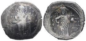 Alexius I Comnenus, AD 1081-1118. Bl, Trachy. 4.18 g 24.48 mm. Philippopolis.
Obv: [+ KЄ BOHΘ] AΛЄΞIω. Christ seated facing on backless throne, with n...