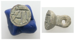 AE Late Roman stamp seal (c. 4 century AD)
Conical-shaped bronze stamp seal with loop at top for suspension; on the face, monogram. 
Weight: 4.33 g.
D...