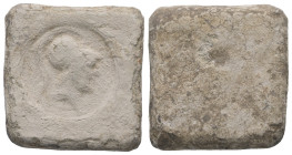 PB Eastern Mediterranean/Aegean. Hellenistic weight (4th–1st centuries BC)
Square in form, rounded corners. On the obverse, circular stamp with bust o...
