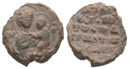 PB Byzantine seal of Ignatios, monk (11th century AD)
Obv.: Half-length of the Mother of God holding the Child in her left arm and presenting Him with...