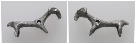 Scythian silver zoomorphic fitting (c. 7th–6th century BC).
Stylized ram, showing head with its curved horns and partial body including neck and foreq...