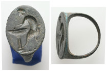 Greco-Roman bronze finger-ring: Satyr pouring wine (1st–2nd century AD)
Bronze finger-ring; the oval bezel engraved with a young satyr pouring wine fr...