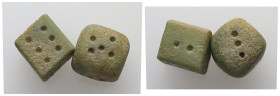 Stone gaming dice. Eastern Mediterranean (1st century BC – 2nd century AD)
A pair of greenish stone dice, square in form. The faces are marked with pi...