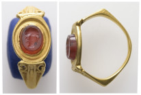 Roman gold ring with intaglio (3rd century AD or later)
Gold finger-ring. Oval bezel with a raised rim, set with a carnelian intaglio engraved with a ...