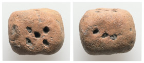 Terracota gaming dice (AD 1st–3rd centuries)
A terracota dice. The numbers are indicated by holes on sides.
Weight: 3.91 g. 
Diameter: 17.70 mm.