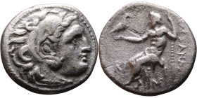 Alexander III (336-323 BC) Drachm Obverse: Head of Herakles to right, wearing lion skin headdress Rev: Zeus seated left on low throne, holding long sc...